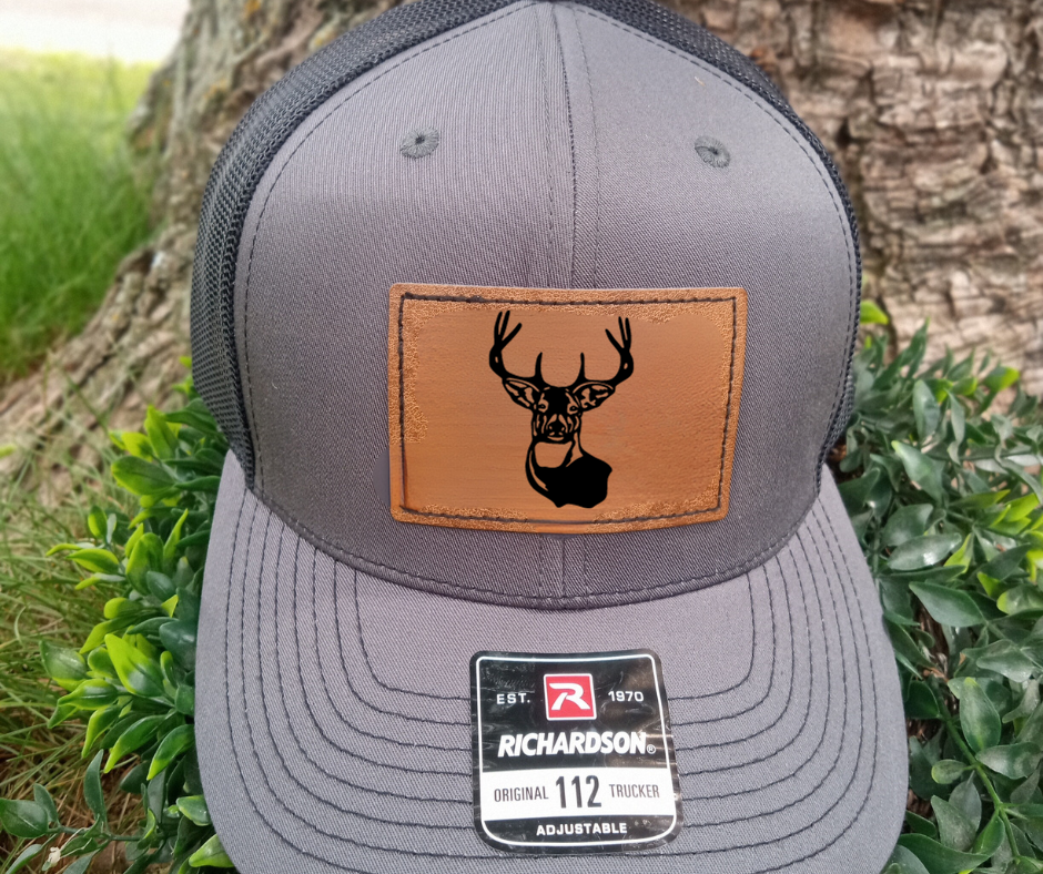 leather patch hat with buck on it